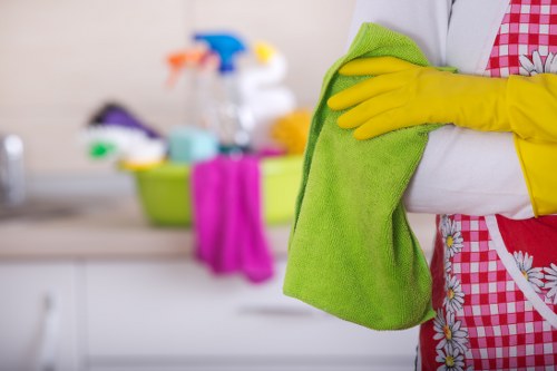 Staff member wearing PPE while conducting a carpet cleaning risk assessment